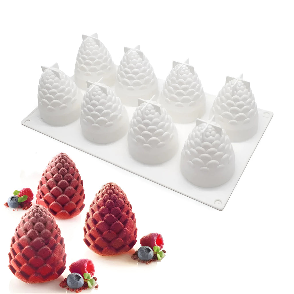 Silicone baking mould with six cavities showing pineapple and pine cone shapes for mousse desserts