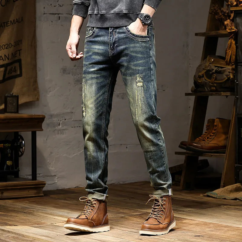 Men's retro blue jeans with stretch fabric in skinny fit style showing zip fly detail