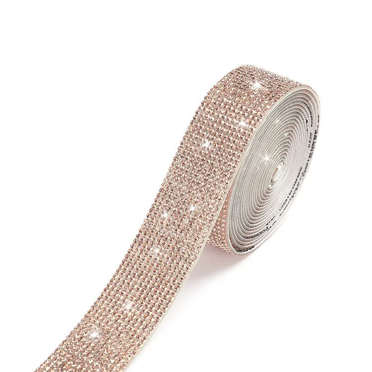 Self-adhesive water drill rhinestone strip in white and AB colour on a one-yard roll.