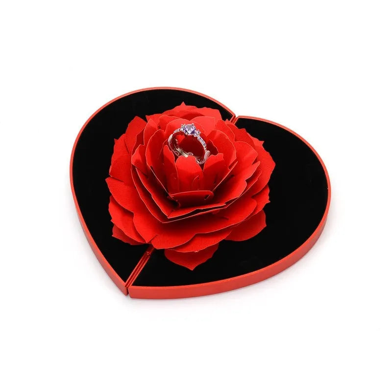 Red heart-shaped rotating plastic ring box for jewellery presentation