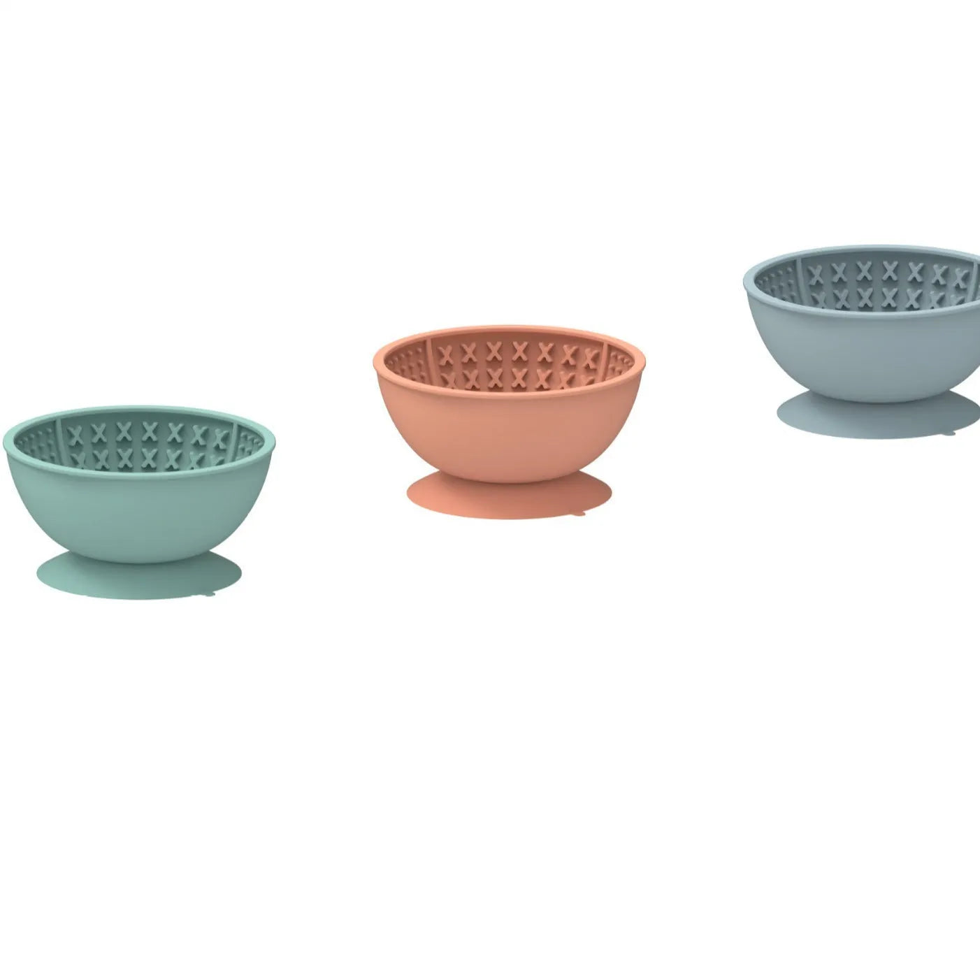 Cyan silicone pet licking mat and slow feeding bowl with suction cup base on a floor.