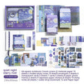 A6 creative journal gift box open to show grid notebook, bookclothes cover, material paper, cards, envelopes, stickers, and a water drop bookmark.