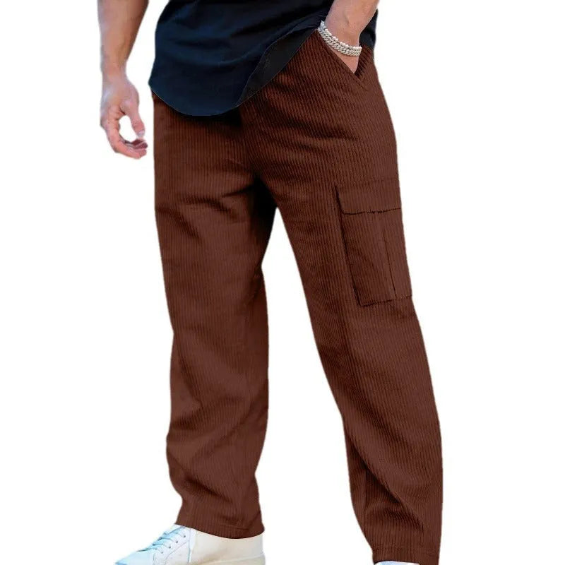 Men's loose-fitting corduroy cargo trousers in navy blue with a drawstring waist and straight wide legs.