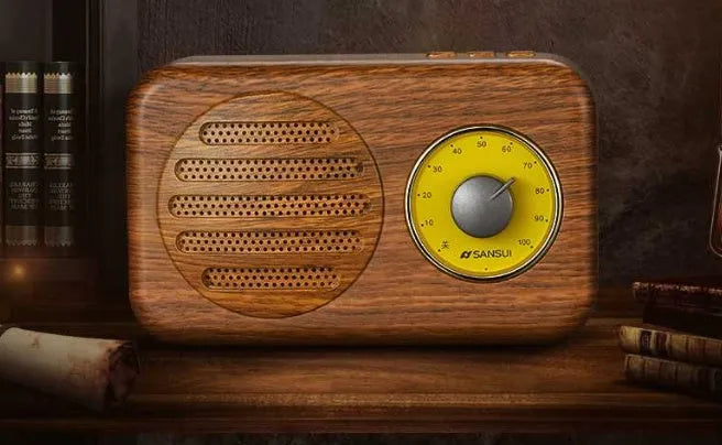 Portable Bluetooth speaker in wood grain finish with FM radio and micro USB cable