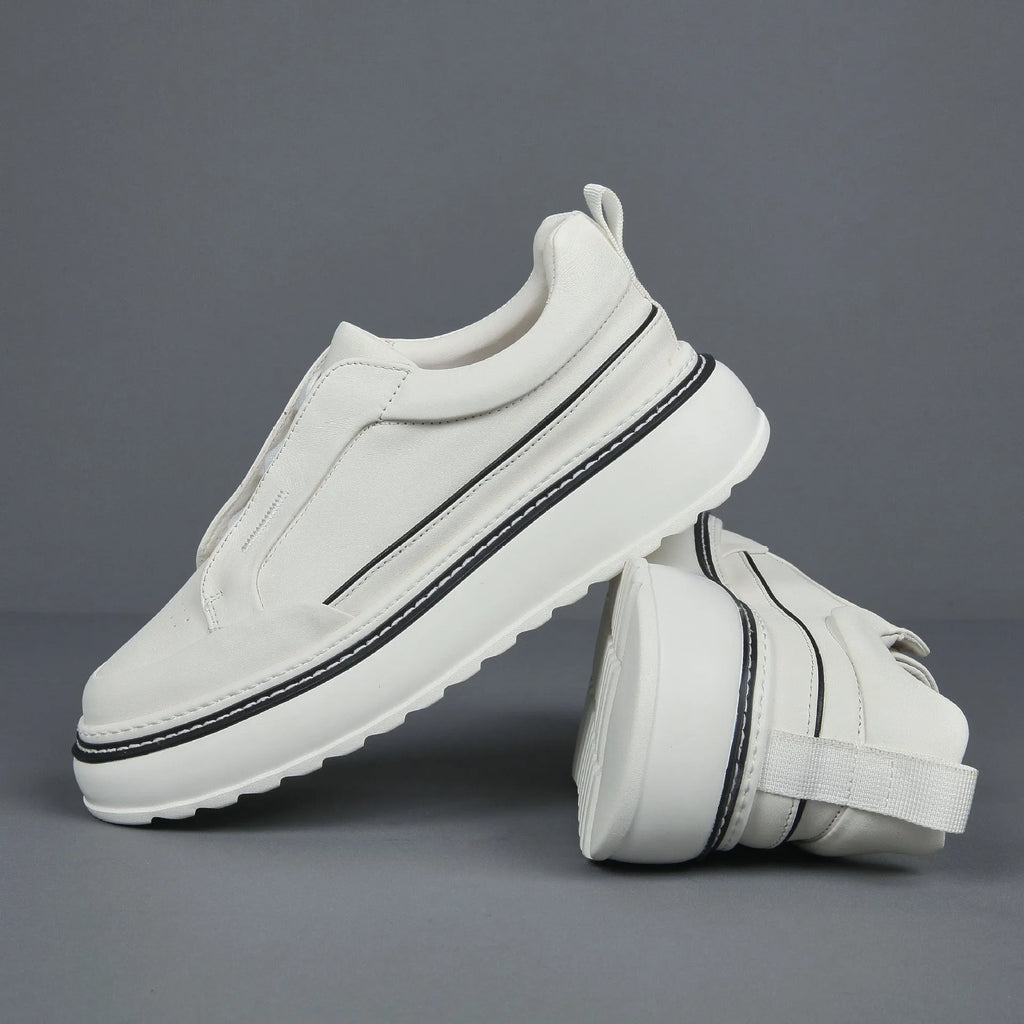 Breathable casual slip-on sneaker in black with first layer cowhide upper, platform mid heel, and sewing thread detail