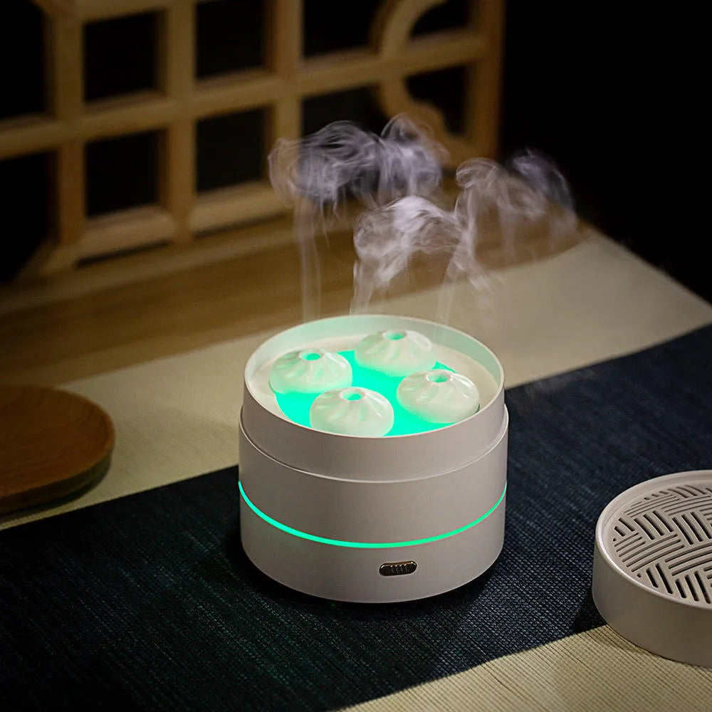 Coffee coloured aroma diffuser with four spray nozzles and LED light display