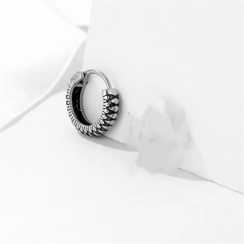 Geometric round stainless steel earrings with retro striped pattern in silver colour