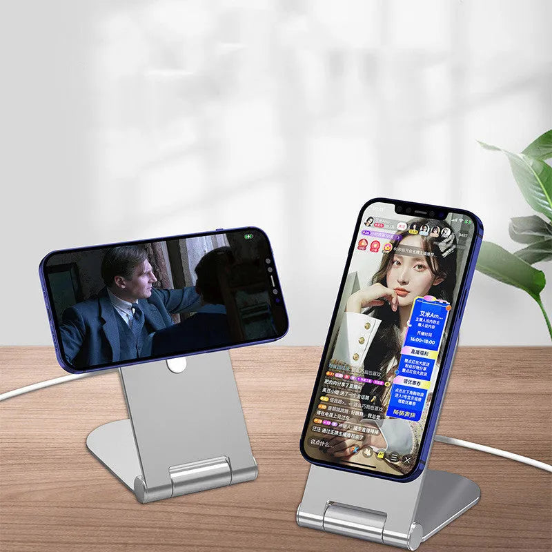 Silver portable magnetic phone bracket for iPhone 12 shown on a car dashboard.