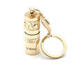 Gold-coloured zinc alloy mini portable LED flashlight on a keyring.