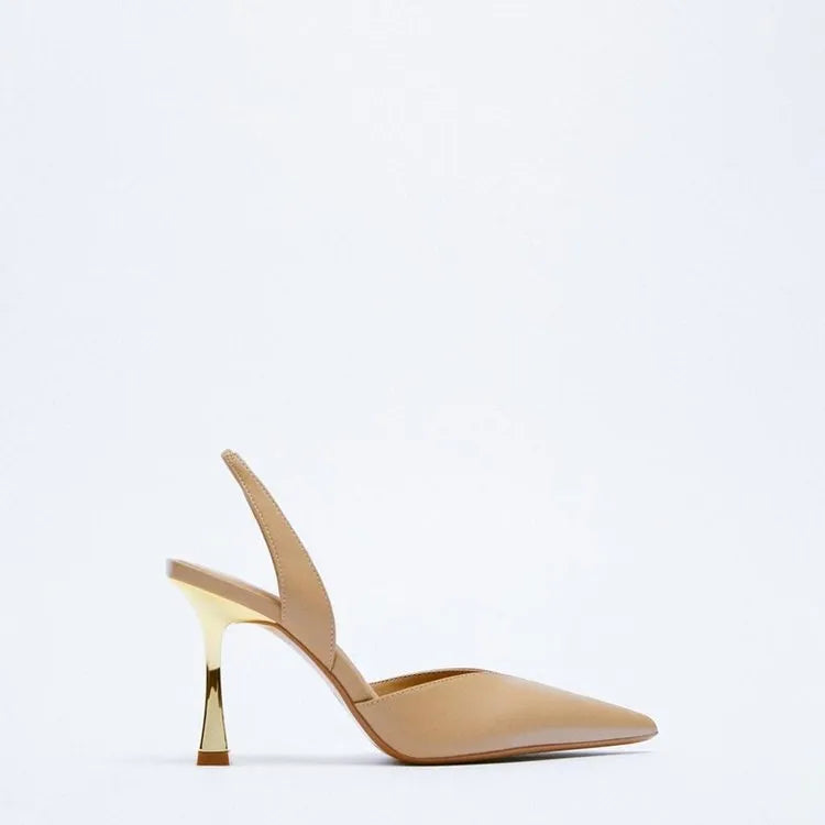 Women's pointed-toe patent leather high heels in apricot and black, showing shallow-cut vamp design.