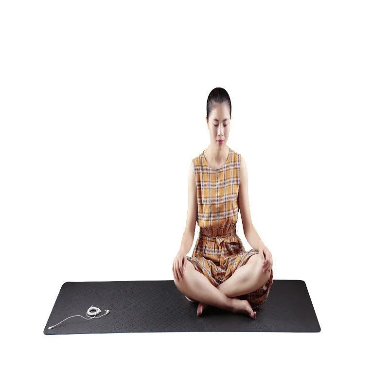 Blue yoga mat with plant patterns, showing grounding wire and non-slip texture.