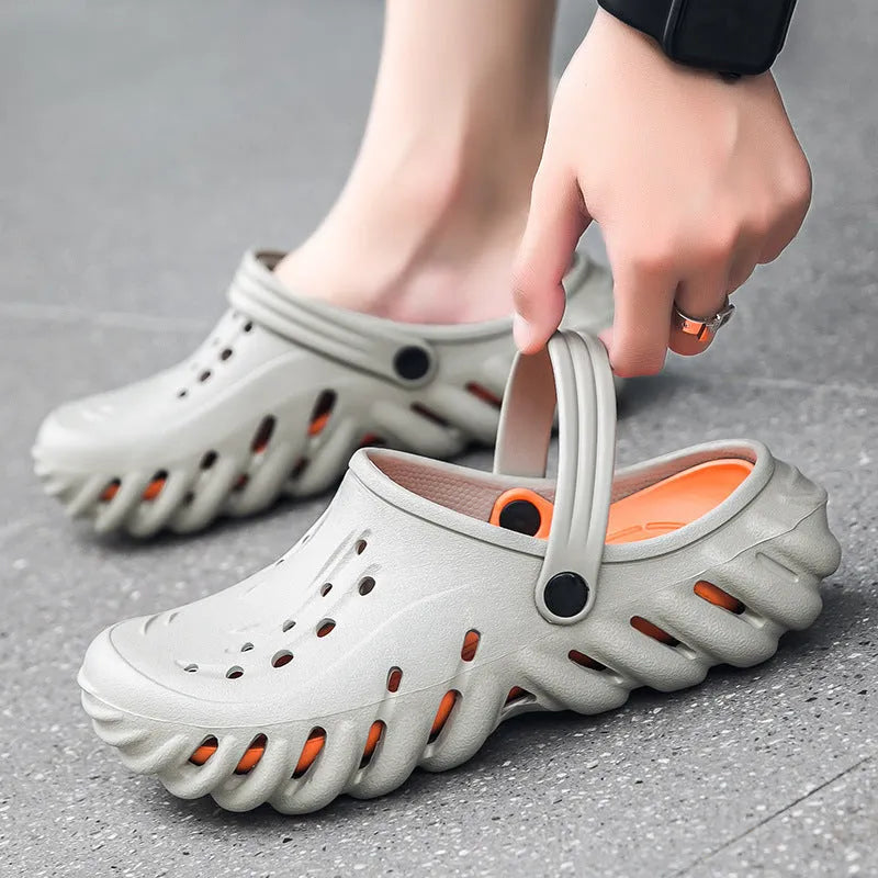 Men's beige EVA slipper sandals with hollow-out design and round toe on a non-slip sole.