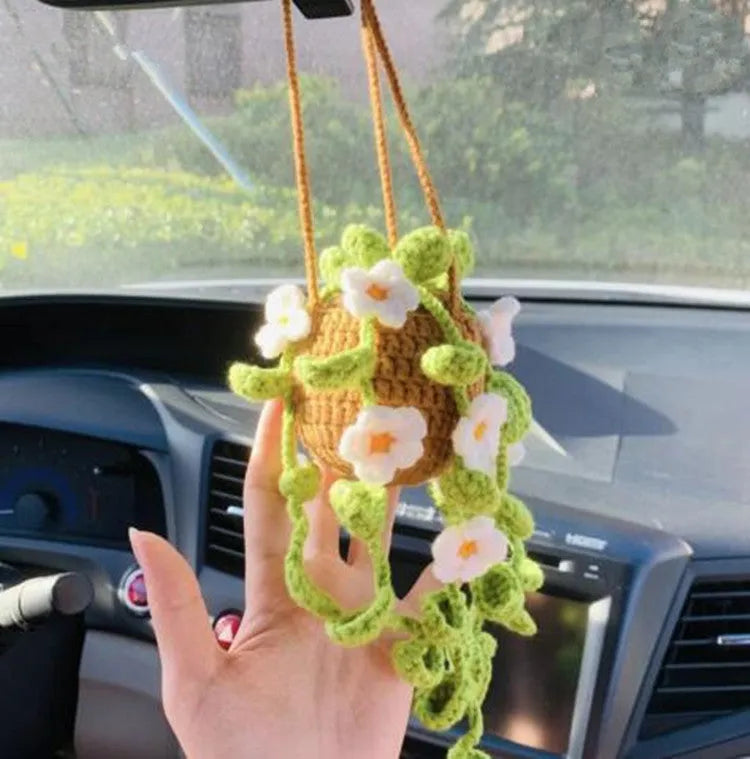 Green and white knitted wool car plant decoration with 8cm base and hanging rope.