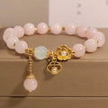 Women's pink crystal flower bracelet showing floral arrangement of stones on wrist