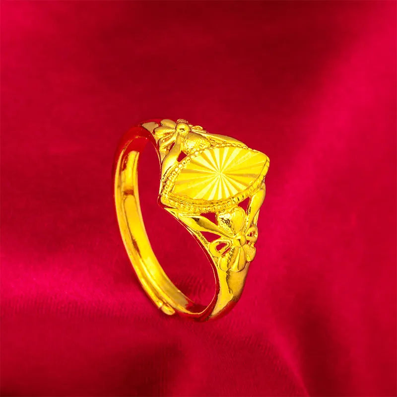 Geometric gold open ring with textured diamond flower detail on brass