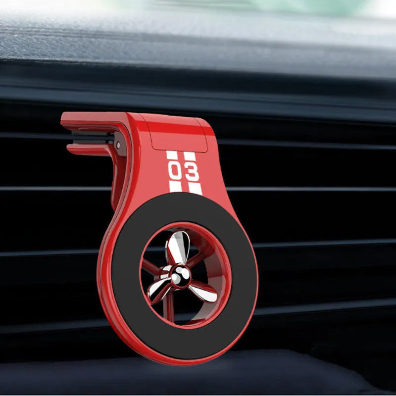 Black magnetic car phone holder mounted on vehicle air vent with smartphone attached
