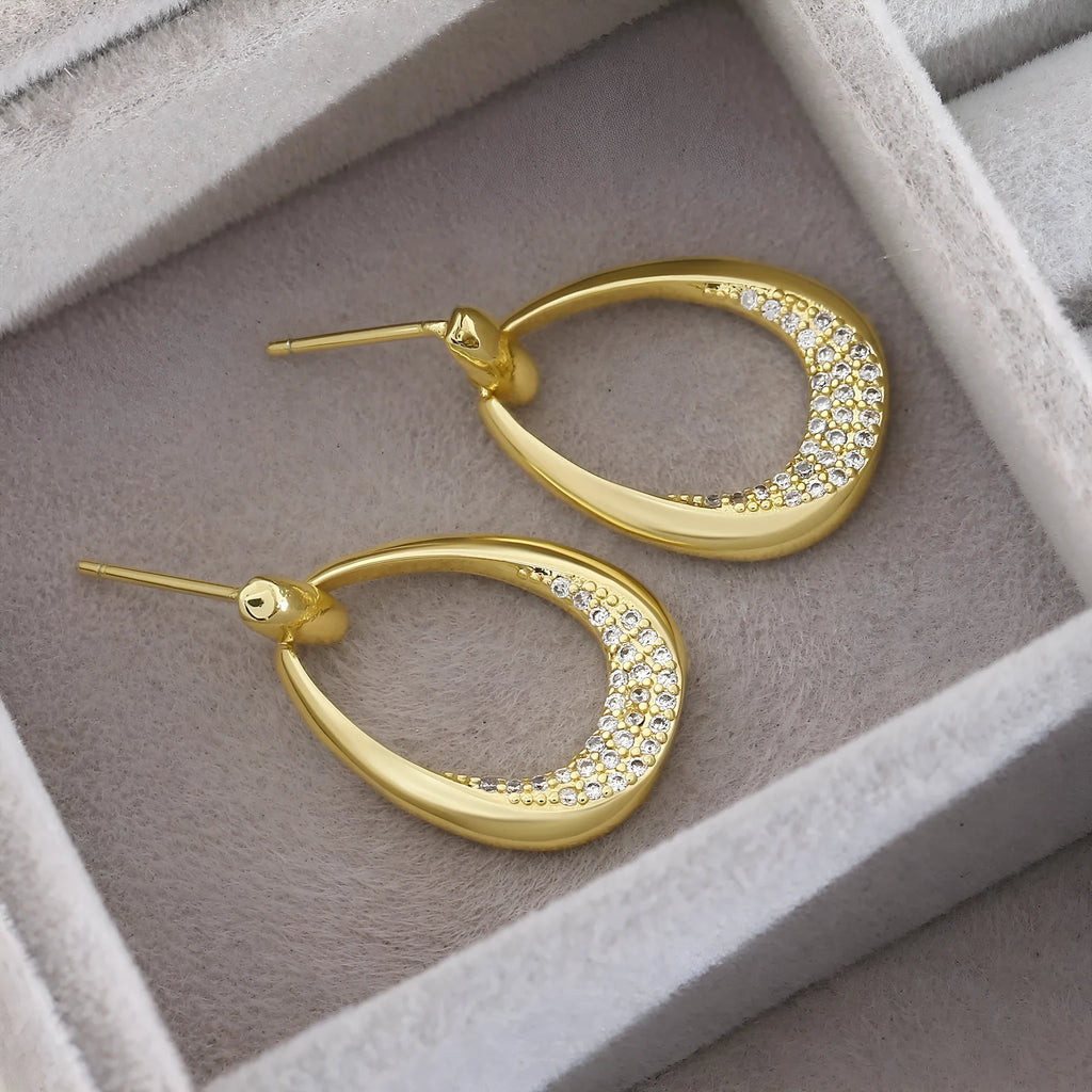 Yellow gold geometric ring drop earrings with electroplated finish on copper, 2.6 x 1.7 cm dimensions