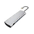 Grey aluminium USB-C docking station with HDMI, VGA, and USB ports.