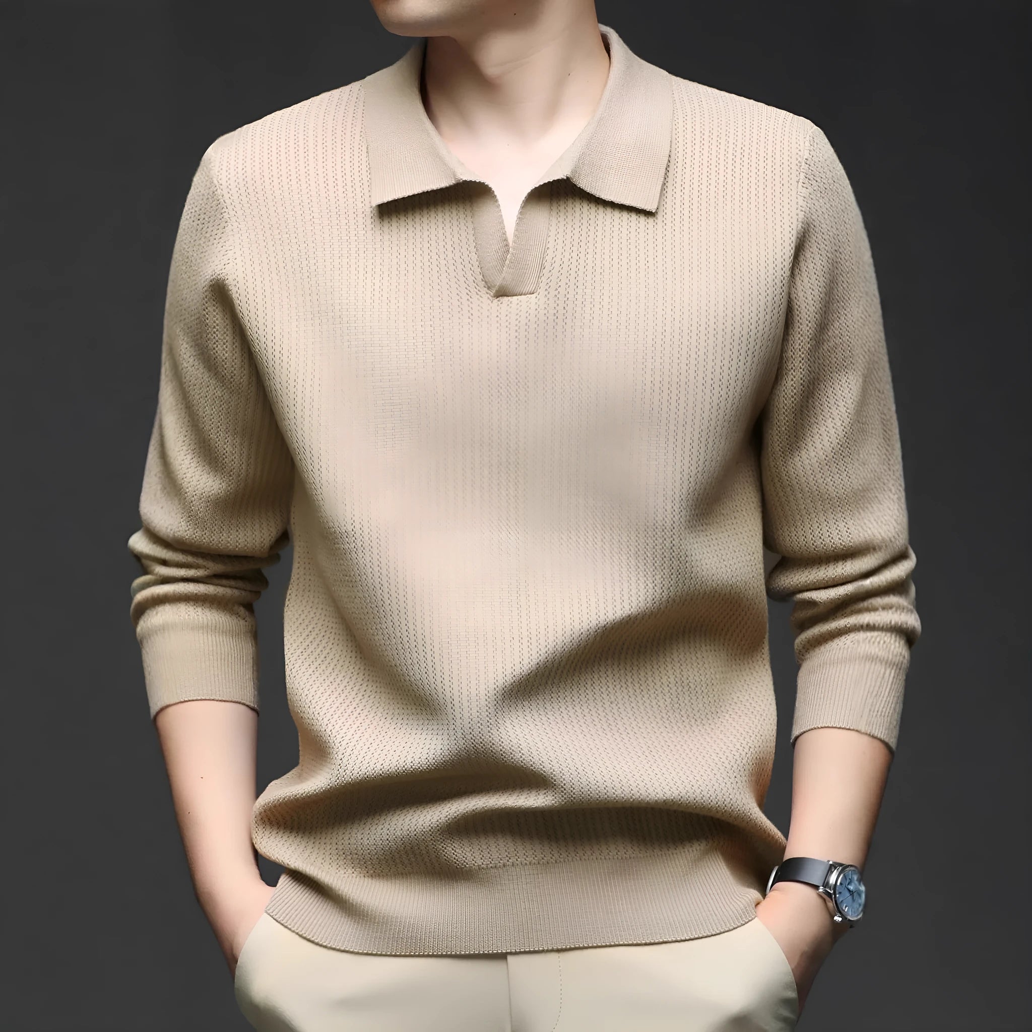 Man wearing a loose green casual pullover sweater, showing the simple long-sleeve design.