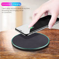 Black circular Qi wireless charging pad for iPhone 11 with LED light indicator