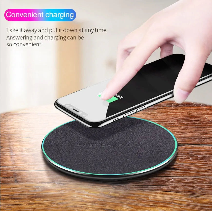 Black circular Qi wireless charging pad for iPhone 11 with LED light indicator