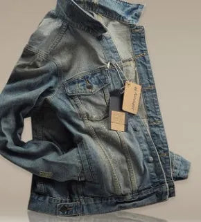 Men's blue denim jacket with five pockets, full button front, and shirt collar on a man