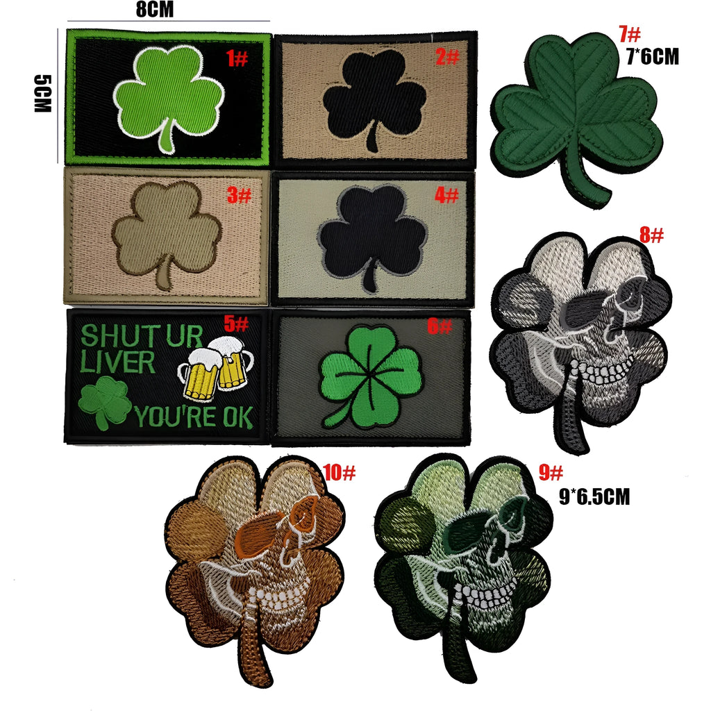 Embroidered fabric badge with Velcro strip showing clover design in green colour