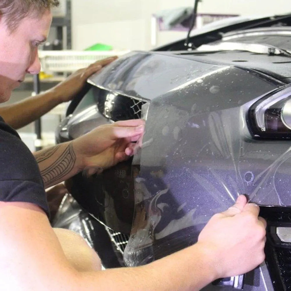 Transparent TPH car paint protection film roll showing clear coating for full vehicle exterior wrap