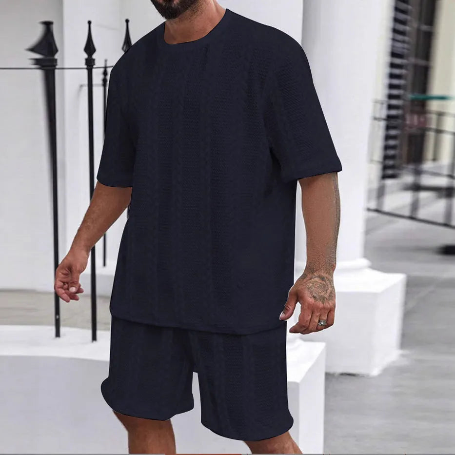 Men's knitted jacquard short sleeve pullover and shorts set in a solid colour on a hanger.