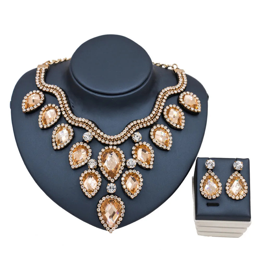 Gold finish colourful exaggerated bride necklace and earring set with royal blue accents