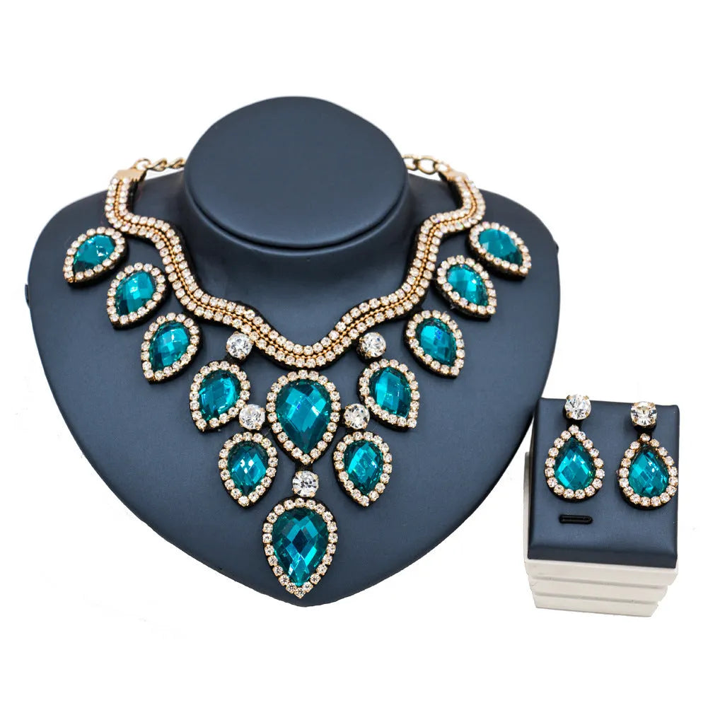 Gold finish colourful exaggerated bride necklace and earring set with royal blue accents