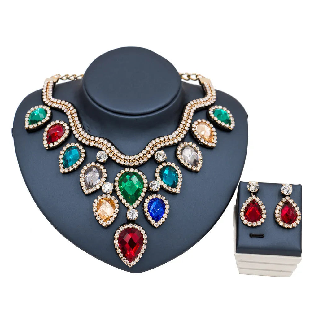 Gold finish colourful exaggerated bride necklace and earring set with royal blue accents