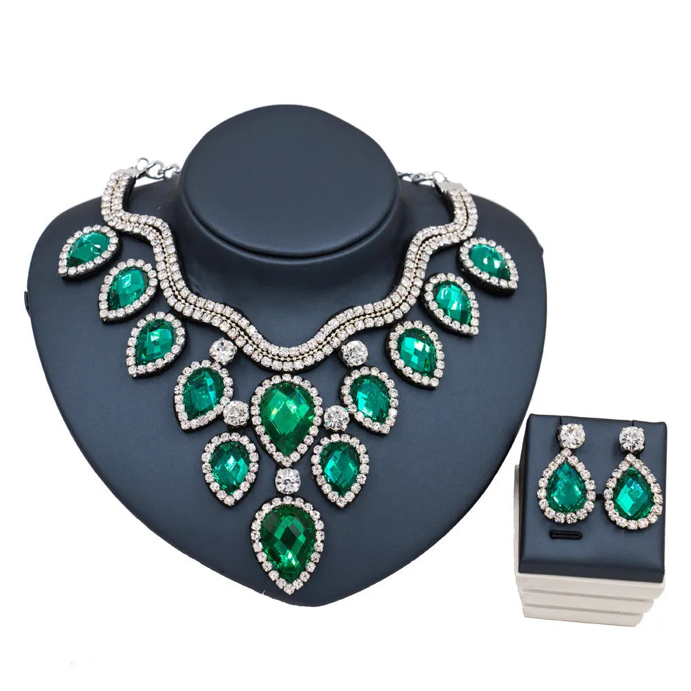 Gold finish colourful exaggerated bride necklace and earring set with royal blue accents