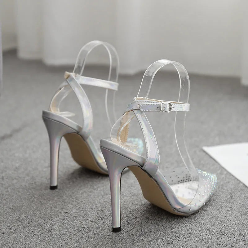 Women's pointed-toe stiletto sandals with a diamond detail on the PVC upper.
