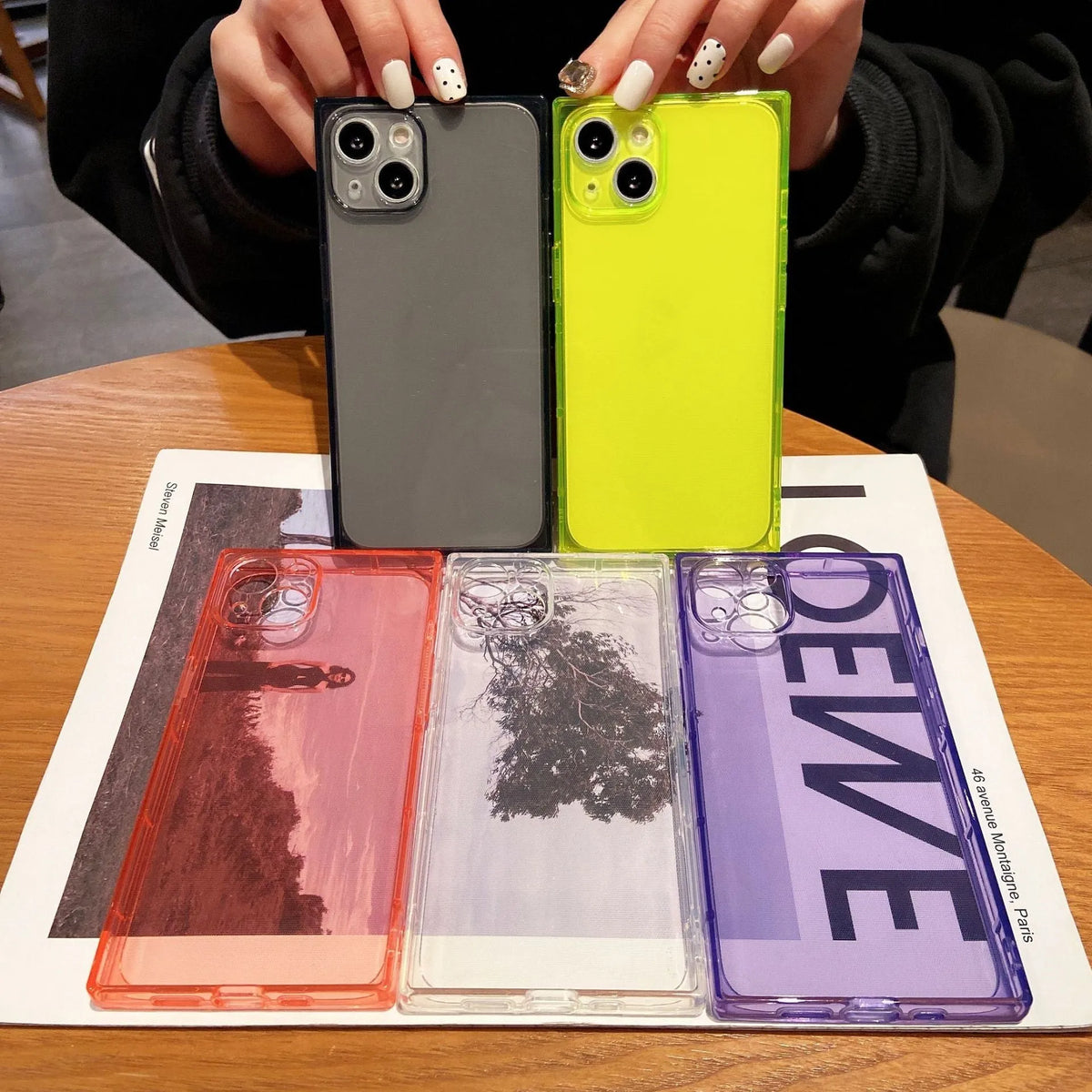 Square fluorescent TPU phone case for iPhone 13 in violet showing embossed texture and camera cutout