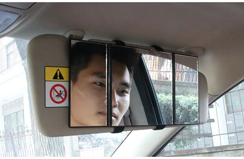 Silver car folding makeup mirror shown closed at 15.5 cm and opened at 30.5 cm wide.