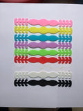 Eight silicone protective buckles in different colours for cable organisation