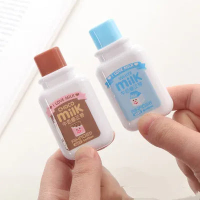 White creative correction tape dispenser shaped like a cute bottle with a curved ergonomic design