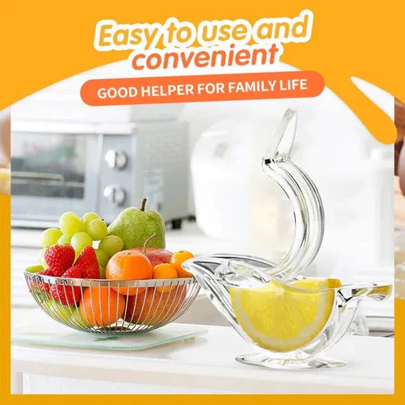 Clear acrylic bird-shaped manual lemon juicer kitchen gadget on countertop
