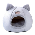 Large grey enclosed sofa-style winter nest cat bed for indoor cats, showing removable fleece lining.
