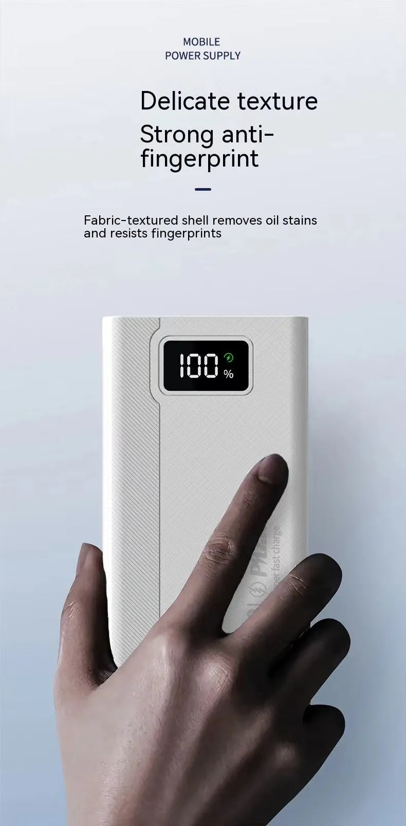 Large capacity black and white power bank with fast charging support showing size scale.