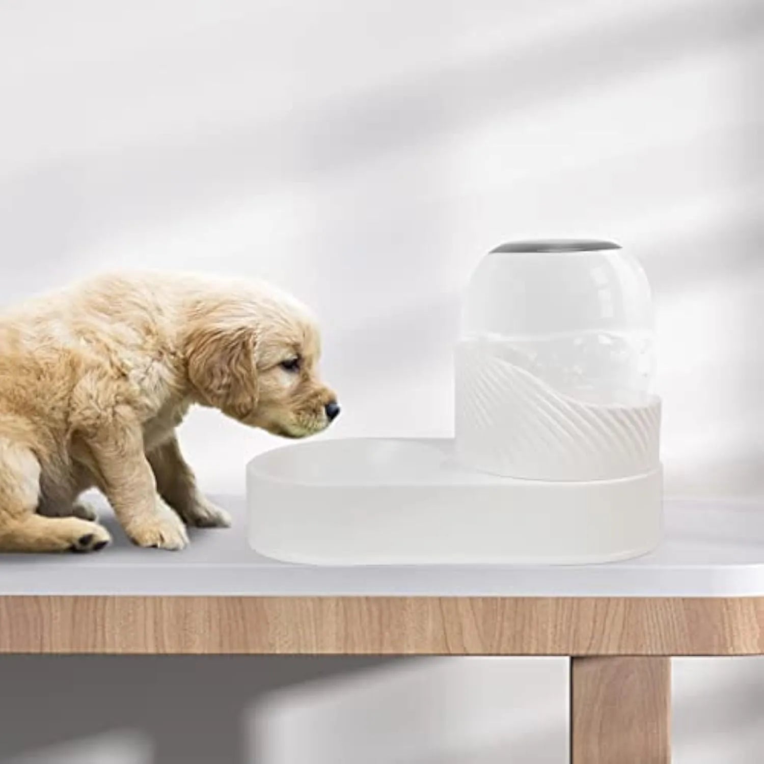 White wave-shaped automatic cat feeder and water dispenser set with 2-litre capacity.