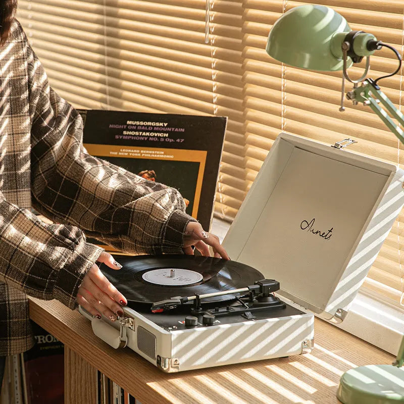 Retro phonograph Bluetooth record player in leather suitcase case with turntable and controls