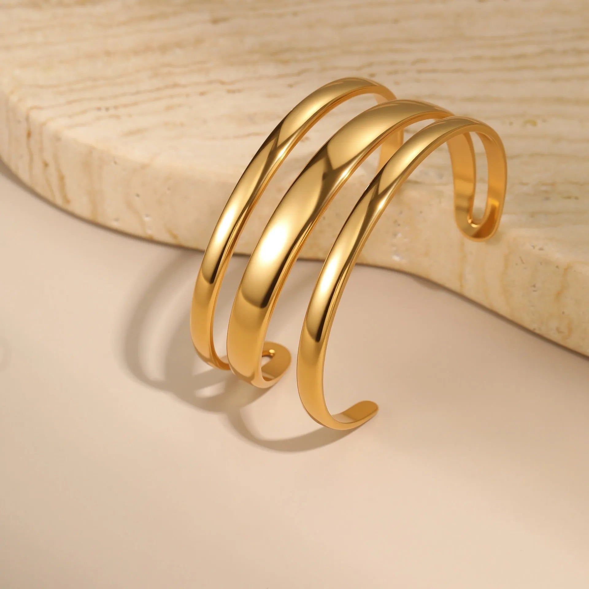 Women's stainless steel geometric line bracelet with 18K gold plating and simple opening clasp