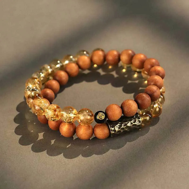 Handcrafted Barbie tan yellow tower crystal double ring bracelet on wrist.