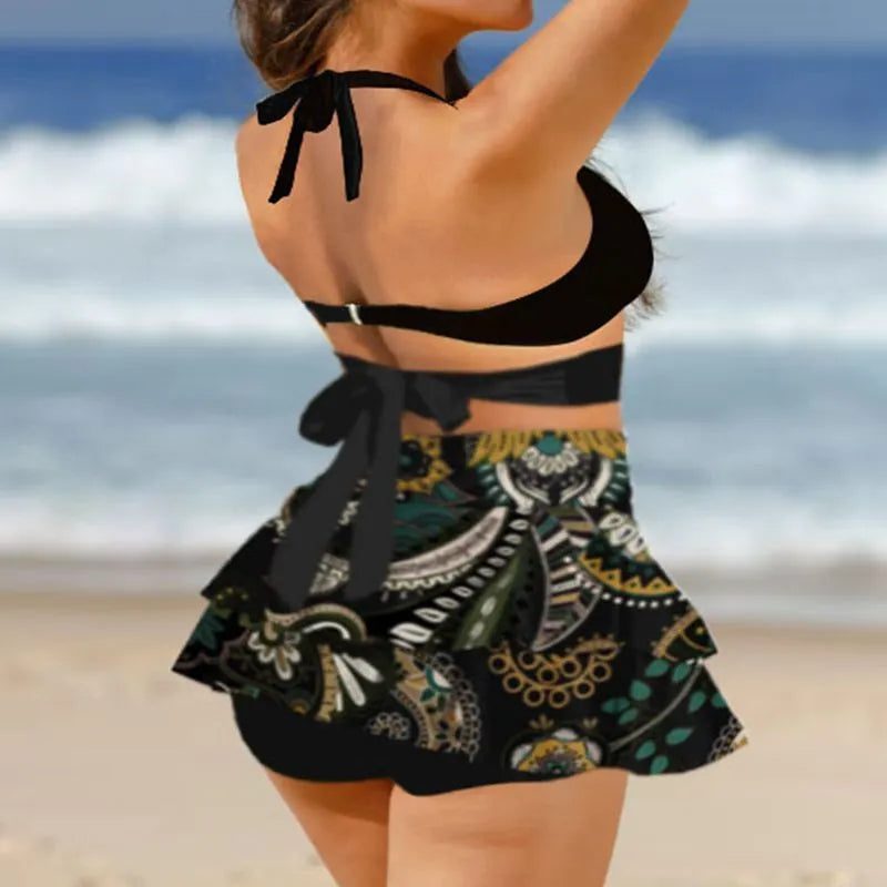 Women's purple split bikini set with high-waisted briefs and matching skirt for swimming