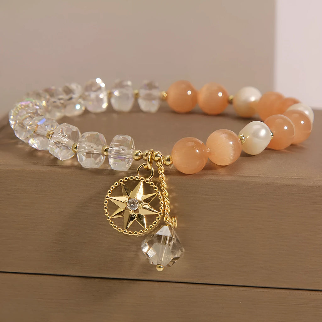 Gold-plated bracelet with eight Awn star motif and orange opal crystals