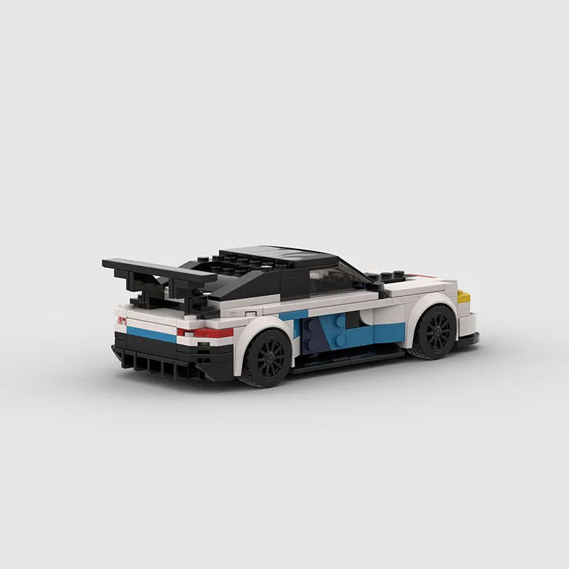 BMW M8 GTE building block car model kit assembled on a flat surface, showing 17cm length and plastic construction