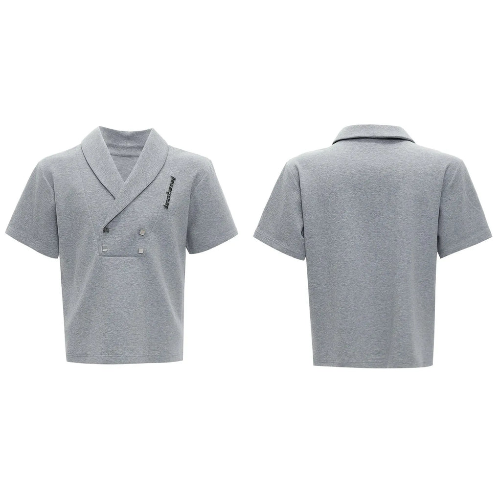 Men's dark grey cotton sports suit with V-neck short sleeve top, padded shoulders, metal embellishments, and matching shorts.