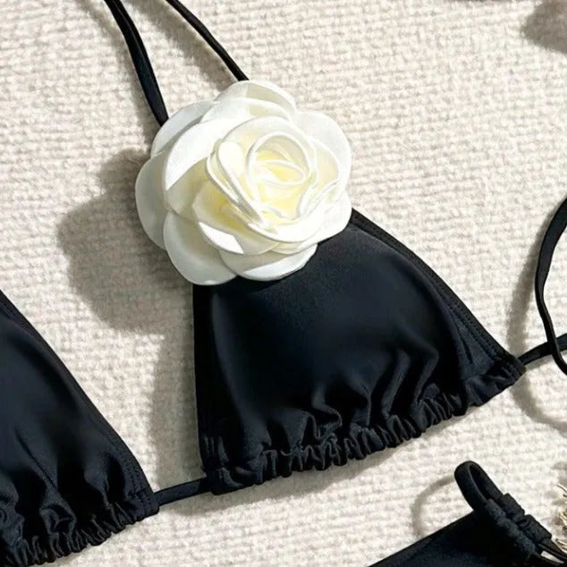 Black women's bikini set with 3D flower patterns, drawstring waist, and backless briefs design